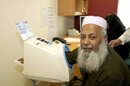 Imam of Mosque checking his blood pressure